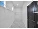 Spacious walk-in closet featuring built-in shelving and marble flooring at 22548 W Huntington Dr, Buckeye, AZ 85326