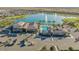 Aerial view of the community clubhouse, pool and community lake at 24953 N 172Nd Dr, Surprise, AZ 85387