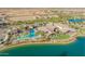 Aerial view of the community pool, clubhouse, and lake with fountains at 24953 N 172Nd Dr, Surprise, AZ 85387