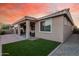 Backyard featuring covered patio, artificial turf, and block wall at 24953 N 172Nd Dr, Surprise, AZ 85387