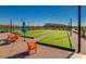 Active adult community with bocce ball court and Adirondack chairs at 24953 N 172Nd Dr, Surprise, AZ 85387