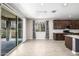 This dining room has neutral colored walls, a sliding door and a dark wood cabinets in the background at 24953 N 172Nd Dr, Surprise, AZ 85387