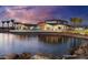 Beautiful waterfront community clubhouse with covered patios at sunset at 24953 N 172Nd Dr, Surprise, AZ 85387