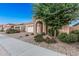 Charming single-story home with a brick-paved driveway and stone-accented entryway at 24953 N 172Nd Dr, Surprise, AZ 85387