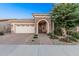 Charming single-story home with a brick-paved driveway and stone-accented entryway at 24953 N 172Nd Dr, Surprise, AZ 85387