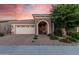 Charming single-story home with a brick-paved driveway and stone-accented entryway at 24953 N 172Nd Dr, Surprise, AZ 85387