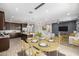 Open floor plan view of the kitchen, dining room and living room, featuring wood floors and recessed lighting at 24953 N 172Nd Dr, Surprise, AZ 85387