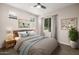 Comfortable bedroom with neutral tones, featuring stylish decor, lamps, and a ceiling fan at 24953 N 172Nd Dr, Surprise, AZ 85387