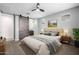 Comfortable main bedroom featuring a sliding barn door and a neutral color palette, creating a serene space at 24953 N 172Nd Dr, Surprise, AZ 85387
