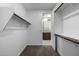 Well-organized walk-in closet with shelving, offering easy access to the Primary bathroom at 24953 N 172Nd Dr, Surprise, AZ 85387
