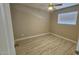 Bedroom featuring wood-look flooring, neutral walls, and a ceiling fan at 2548 E Encanto St, Mesa, AZ 85213