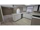 Modern kitchen featuring white cabinets, stainless steel appliances, and a stylish island at 2548 E Encanto St, Mesa, AZ 85213