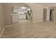 Open-concept kitchen with archway, white cabinets, and stainless steel appliances at 2548 E Encanto St, Mesa, AZ 85213