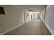 Bright living room featuring tile flooring, neutral walls, and plenty of natural light from the many windows at 2548 E Encanto St, Mesa, AZ 85213