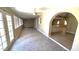 Spacious living room featuring neutral walls, tile floors, and multiple windows for natural light at 2548 E Encanto St, Mesa, AZ 85213