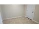 Light-filled room showcasing neutral walls, tiled floor, and door at 2548 E Encanto St, Mesa, AZ 85213