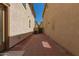 Low-maintenance backyard showcasing a paved patio area between neighboring properties at 2640 N 73Rd Gln, Phoenix, AZ 85035
