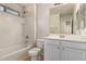 Bright bathroom featuring a tub, shower, toilet, and vanity with sink at 2640 N 73Rd Gln, Phoenix, AZ 85035
