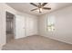 Neutral bedroom with view to ensuite, closet and bright window at 2640 N 73Rd Gln, Phoenix, AZ 85035