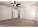 Neutral bedroom features carpeted floors, a ceiling fan and a door at 2640 N 73Rd Gln, Phoenix, AZ 85035