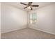 Well-lit bedroom with neutral carpet, one window, and ceiling fan at 2640 N 73Rd Gln, Phoenix, AZ 85035