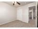 Neutral bedroom with ceiling fan, plush carpet, and closet for ample storage at 2640 N 73Rd Gln, Phoenix, AZ 85035