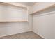 Walk-in closet with built in shelves and carpeted floor at 2640 N 73Rd Gln, Phoenix, AZ 85035
