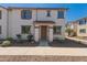Charming townhome featuring a covered entryway, desert landscaping, and a neutral color palette at 2640 N 73Rd Gln, Phoenix, AZ 85035