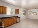 Spacious kitchen area offering ample cabinetry, stainless steel appliances, and a light-filled adjacent dining space at 2640 N 73Rd Gln, Phoenix, AZ 85035