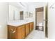 Bright bathroom featuring a long vanity with tile floors and a neutral color scheme at 2783 E Mineral Park Rd, San Tan Valley, AZ 85143