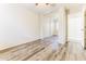 This bedroom has wood floors, a closet with mirrored sliding doors and a bright neutral color scheme at 2783 E Mineral Park Rd, San Tan Valley, AZ 85143