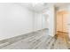 This bedroom has wood floors, and a closet with mirrored sliding doors and is freshly painted at 2783 E Mineral Park Rd, San Tan Valley, AZ 85143