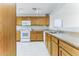 This bright kitchen features modern appliances, wood cabinets, and lots of counter space at 2783 E Mineral Park Rd, San Tan Valley, AZ 85143