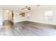 Open-concept living room with wood-look floors and a view into the kitchen, perfect for entertaining at 2783 E Mineral Park Rd, San Tan Valley, AZ 85143