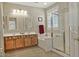 Bathroom featuring double vanity, soaking tub, and glass-enclosed shower at 3522 W Rushmore Dr, Anthem, AZ 85086
