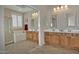 Bright bathroom featuring a double sink vanity, soaking tub, and tiled floors at 3522 W Rushmore Dr, Anthem, AZ 85086