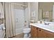 Well-lit bathroom showcasing a vanity with wood cabinets, a shower-tub combo, and neutral decor for a serene experience at 3522 W Rushmore Dr, Anthem, AZ 85086