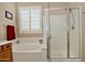 Bright bathroom featuring separate tub and shower with window at 3522 W Rushmore Dr, Anthem, AZ 85086