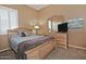 Cozy bedroom with neutral decor, and light wood furnishings at 3522 W Rushmore Dr, Anthem, AZ 85086
