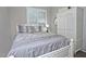 Bedroom with a bed featuring neutral-colored bedding and white furniture at 3522 W Rushmore Dr, Anthem, AZ 85086