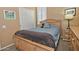 Comfortable bedroom with wood furnishings and a view of the window at 3522 W Rushmore Dr, Anthem, AZ 85086