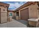 Inviting gated entrance with a cozy seating area next to the garage at 3522 W Rushmore Dr, Anthem, AZ 85086