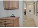 Hallway with built-in cabinets leading to the kitchen area at 3522 W Rushmore Dr, Anthem, AZ 85086