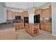 Spacious kitchen featuring an island, granite countertops, and stainless steel appliances at 3522 W Rushmore Dr, Anthem, AZ 85086