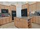 Modern kitchen with granite countertops, stainless appliances, and functional center island at 3522 W Rushmore Dr, Anthem, AZ 85086