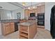 Well-equipped kitchen with granite countertops, stainless steel appliances, and central island at 3522 W Rushmore Dr, Anthem, AZ 85086