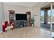 Relaxing living room with entertainment center and access to outdoor patio with pool at 3522 W Rushmore Dr, Anthem, AZ 85086