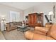 Bright living room offering a large built-in cabinet, plush seating, and soft natural light at 3522 W Rushmore Dr, Anthem, AZ 85086