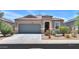 Charming single-story home featuring a tile roof, desert landscaping, and a two-car garage at 36467 W Pampoloma Ave, Maricopa, AZ 85138