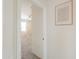 Hallway peek into bedroom with a ceiling fan and carpet flooring at 36467 W Pampoloma Ave, Maricopa, AZ 85138